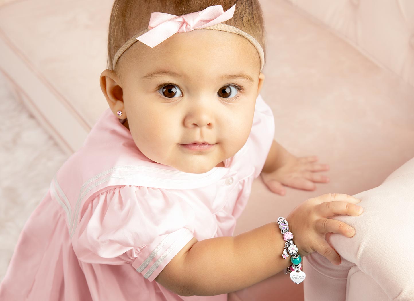 Adoré&trade; Charm Shown on Baby Girl