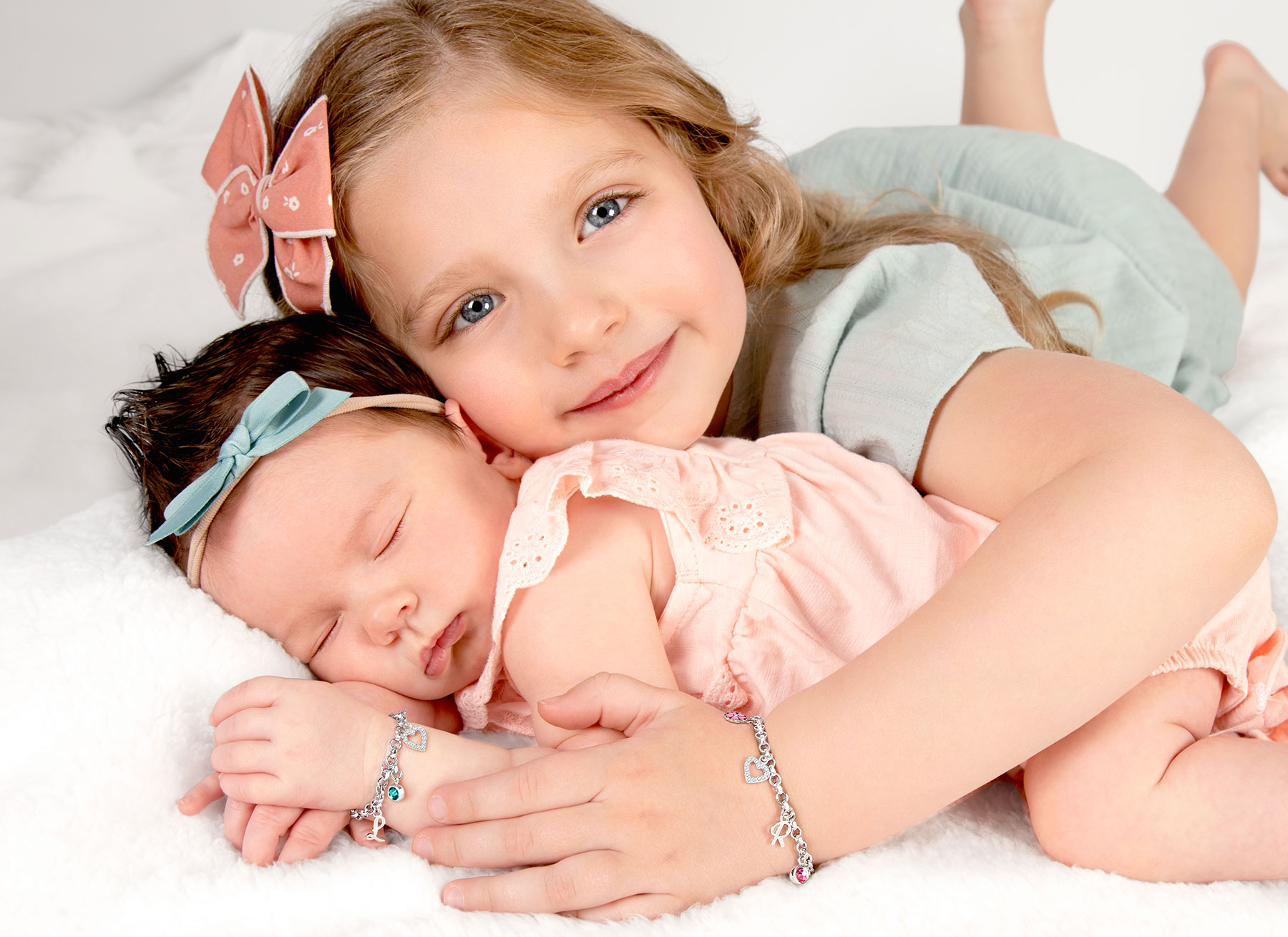 Example Bracelets Shown on Newborn and 4 Year Old Girls
