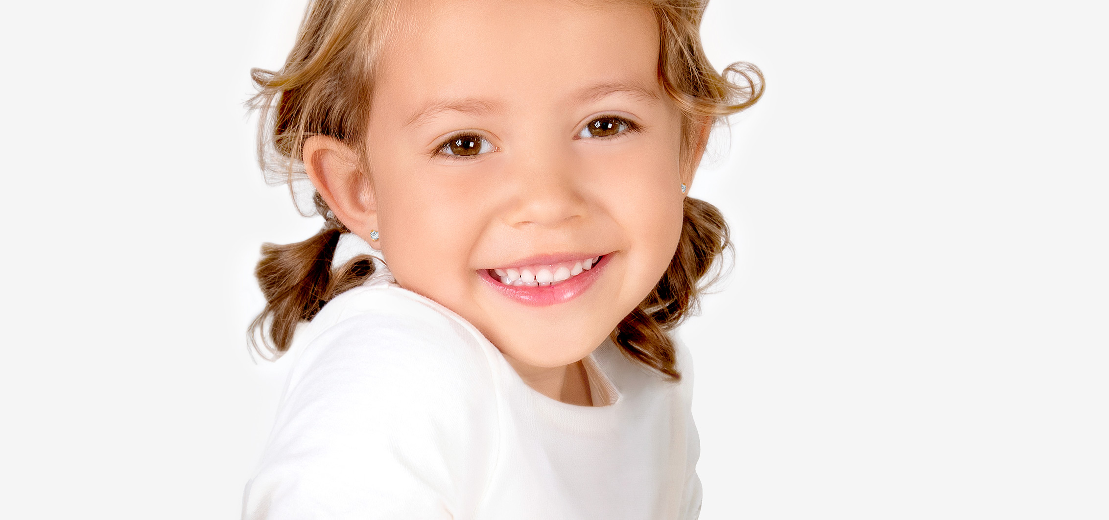 Girl Wearing 14K Gold Elephant Earrings from Tiny Blessings