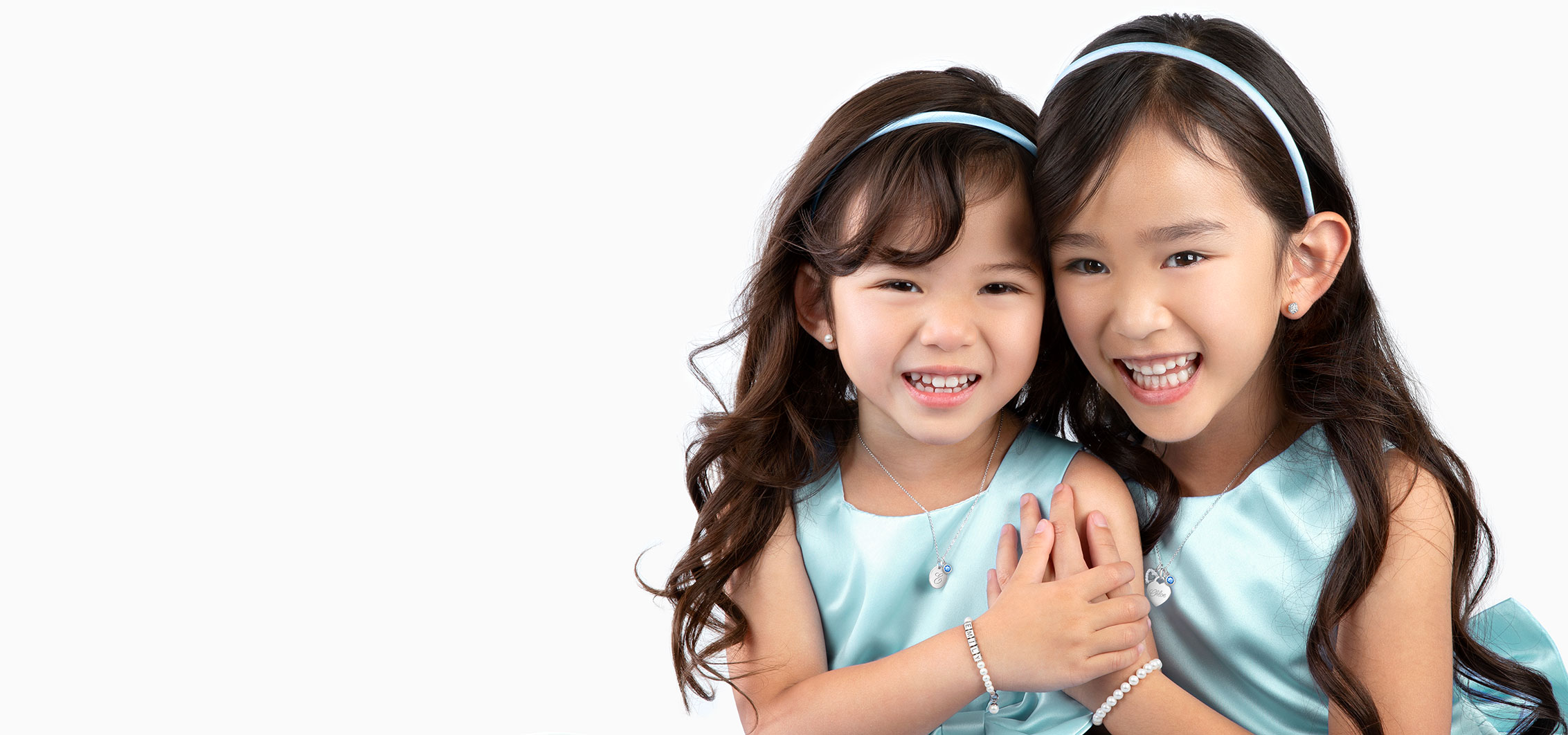 Two Sisters Enjoying Jewelry Gifts